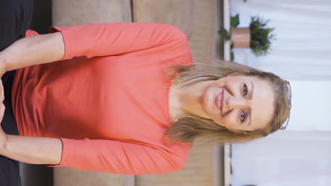 Vertical-video-of-Woman-smiling-at-camera